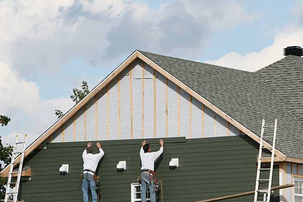 Professional Siding technician working in West Newton, PA